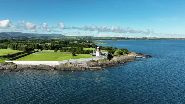 Picturesque coastline with a white lighthouse in 4k