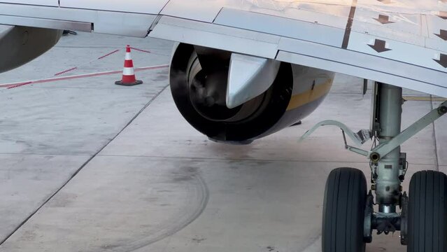 Smoke coming out of a Boeing 737-800 engine parked at the stand