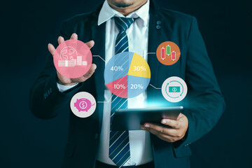 Businessman holds a tablet with graphs and charts Money management.