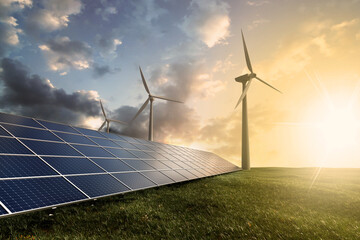 Lush green field adorned with solar panels and wind turbines against a stunning sunset, symbolizing...