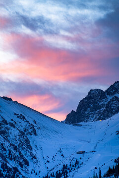 a beautiful pink dawn in the snowy mountains. early morning in the winter mountains © Daniil_98_03_09