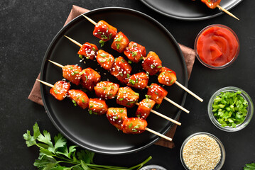 Teriyaki chicken skewers on plate