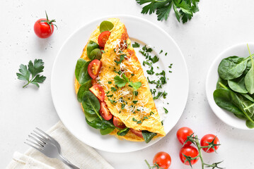 Stuffed omelette with tomatoes and spinach