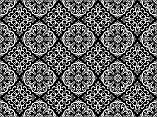 Wallpaper in the style of Baroque. Seamless vector background. White and black floral ornament. Graphic pattern for fabric, wallpaper, packaging. Ornate Damask flower ornament