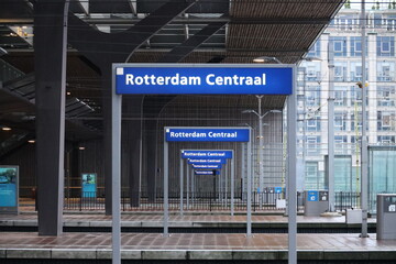Blue nameplates on the platform of Rotterdam Centraal station