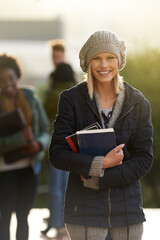 Student, happy woman and portrait with books on campus, education and learning material for...