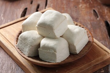 white tofu on wooden table