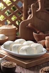 white tofu on wooden table