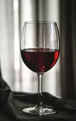 Fotobehang Red wine glass isolated © Lupu