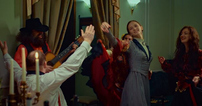 dance with gypsies in retro restaurant in 19 century, rich man and woman having fun, 4K, Prores