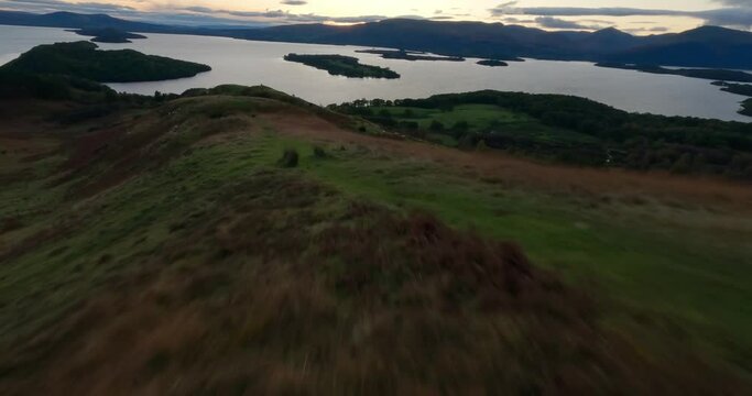 Aerial shot of Loch Lomond while flying over Conic Hill, Highlands, Scotland.
