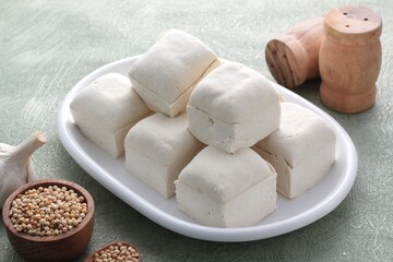 Fototapeta na wymiar white tofu on wooden table