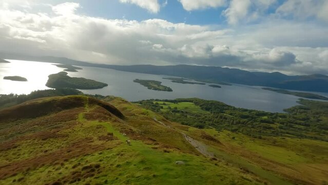 Aerial shot of Loch Lomond while flying over Conic Hill, Highlands, Scotland.
