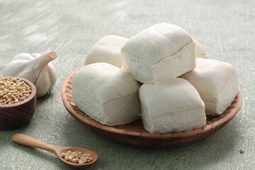 white tofu on wooden table