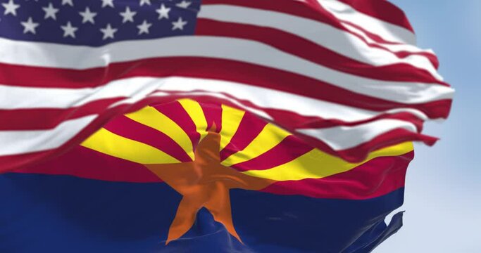 Seamless loop in slow motion of Arizona and United States flags waving