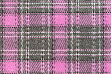 Pink and gray tartan fabric texture. Background for your design. Traditional Scottish clothing and...
