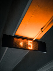 led sign in a dark secure covered parking display places street mood ambiance artistic