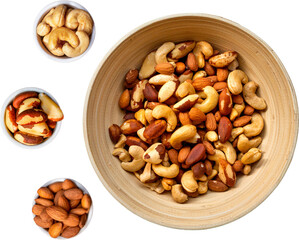 Mix of Brazil nuts, cashews and almonds in a bowl on a transparent background.