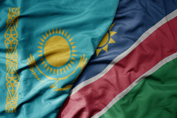 big waving national colorful flag of namibia and national flag of kazakhstan.