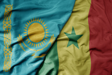 big waving national colorful flag of senegal and national flag of kazakhstan.