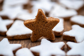 Cinnamon cookies in star shape and heart shape with white cinnamon icing