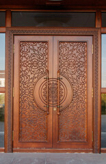 Hand carved wooden doors with patterns.