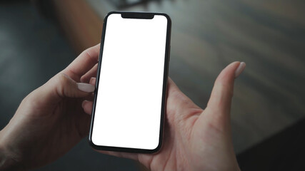 Woman hand holding smartphone with blank screen