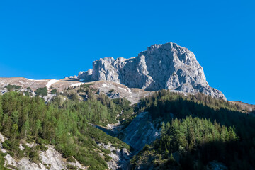 Panoramic view of majestic steep mountain peak Foelzstein in untamed Hochschwab mountain region,...