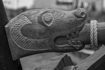 Ornately carved wooden dragon head, black and white