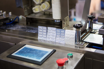 Capsule blister packing machine in pharmaceutical industrial.