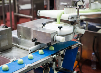 Dough divider and rounder machine. Food and bakery industry production line.