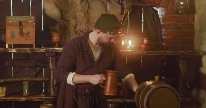 Barkeeper pours beer and looks back scarily