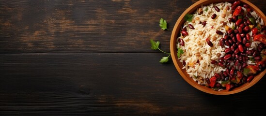 Rice with red beans and vegetables in a bowl on the table horizontal view from above. Creative Banner. Copyspace image - obrazy, fototapety, plakaty