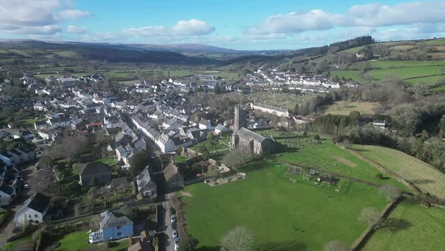 Moretonhampstead, Dartmoor, Devon, England: DRONE VIEWS: The drone flies over the medieval town showing its church, houses & allotments. The town was mentioned in the Domesday Book of 1086AD (Clip 3).