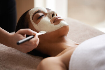 Beauty, relax and woman with face mask at spa for glow, wellness and skincare routine with self...