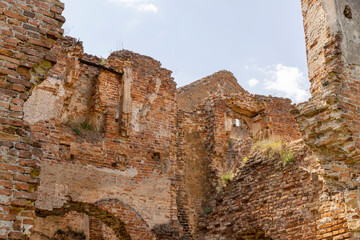 damaged red bricks from the wall of an ancient building