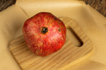 juicy pomegranate on a wooden board
