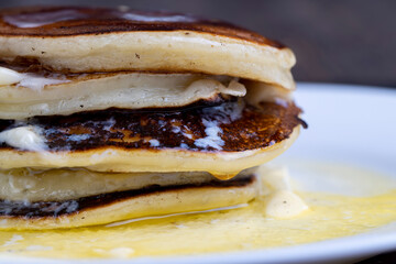 delicious cooked pancakes with cottage cheese and melted butter