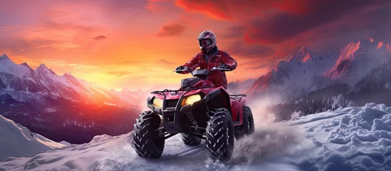 Poster Quad bike rides on a snowy field raising a bunch of splashes against the backdrop of a bright winter sunset Outdoor activities on the ATV. Creative Banner. Copyspace image © HN Works