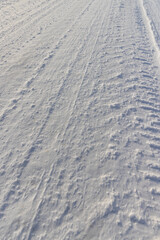 winter road after snowfall in sunny weather