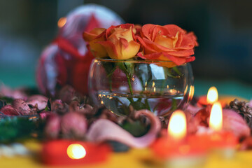 Bouquet of roses, candles and gifts, card for February 14, St. Valentine, March 8, wedding, birthday, mother's day, blurred background, bokeh.