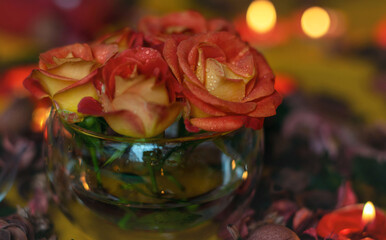 Bouquet of roses, candles and gifts, card for February 14, St. Valentine, March 8, wedding, birthday, mother's day, blurred background, bokeh.