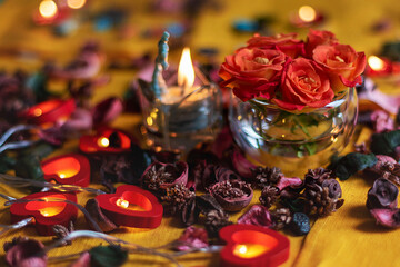 Bouquet of roses, candles and gifts, card for February 14, St. Valentine, March 8, wedding, birthday, mother's day, blurred background, bokeh.