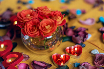 Bouquet of roses, candles and gifts, card for February 14, St. Valentine, March 8, wedding, birthday, mother's day, blurred background, bokeh.