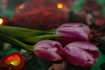 Bouquet of tulips, candles and gifts, card for February 14, Valentine's Day, March 8, wedding, birthday, mother's day, blurred background, bokeh.