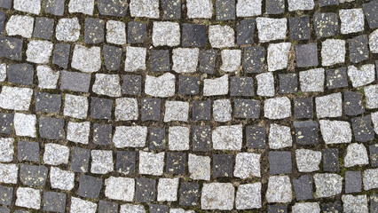 Cobblestone pavement texture background. Cobblestone pavement background.