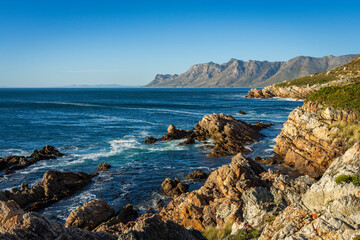 Fototapeta na wymiar View across False Bay towards Gordons Bay along Clarence Drive between Gordon's Bay and Rooi-Els near Cape Town, Western Cape. South Africa