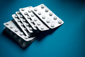Medication tablets packed in blister pack on a table