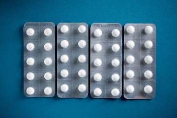 Medication tablets packed in blister pack on a table
