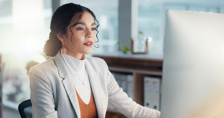 Businesswoman at desk with computer, thinking or typing email, report or article at digital agency. Internet, research and happy woman at tech startup with online review, networking project and smile